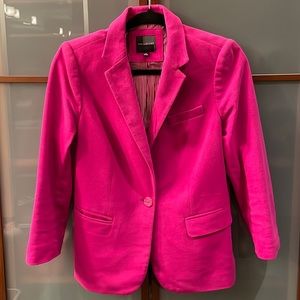 Used- The limited pink blazer, lined with pink and white pinstripes. Size medium
